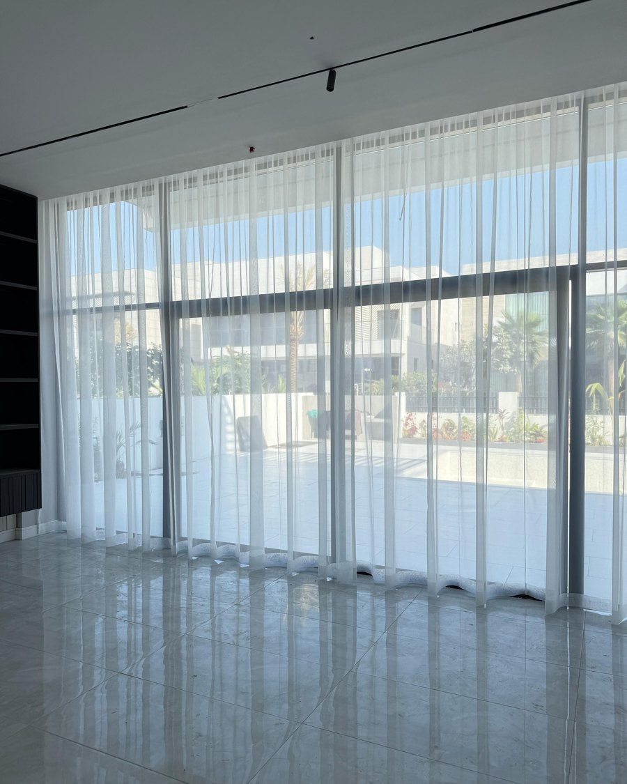 Sheer floor-to-ceiling curtains in a Dubai villa